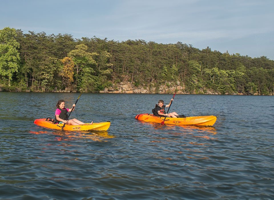 people kayaking on lake 