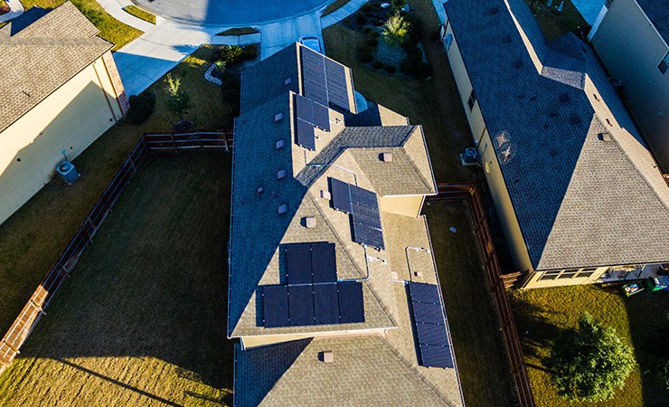 aerial view showing solar panels on roof