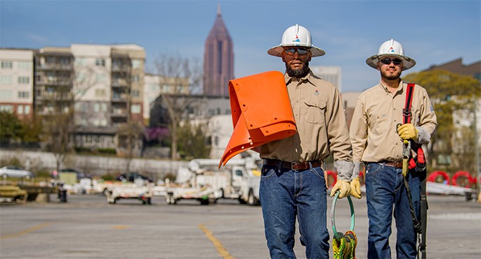 aajogo lineworkers perform work near Atlanta, GA.