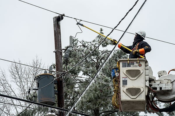 A Georgia Power lineworker restores power following a winter storm. 
