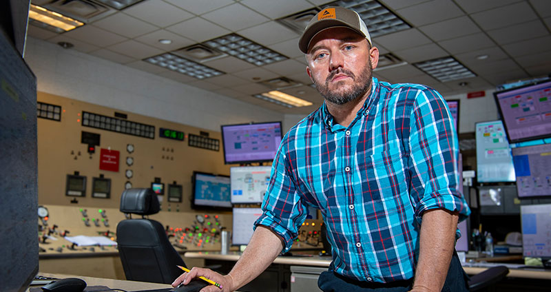 Will monitors Mark VI and DCS screens in a control room at Plant Yates, overseeing turbine and boiler system operations.
