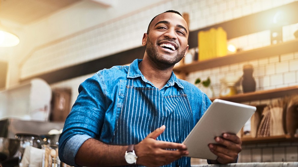 business man looking at his bill on a tablet
