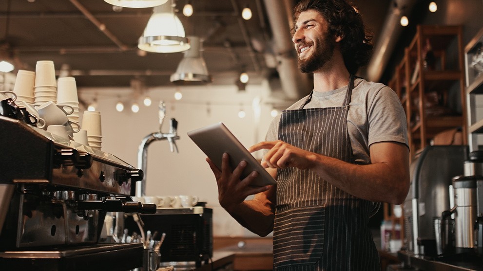 small business owner enjoying energy-saving upgrades