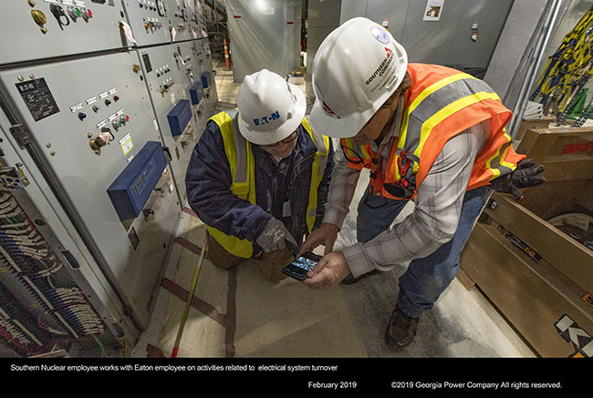 Southern Nuclear employee works with Eaton employee on activities related to electrical system turnover