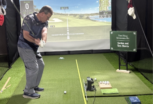 Gordy at his home golf simulator 