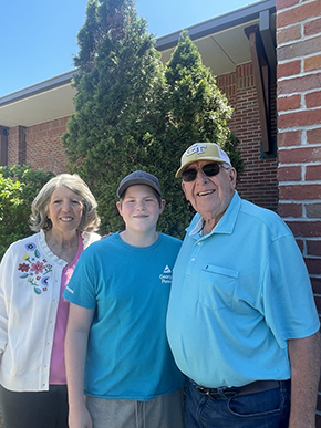 Earl and Tree with grandson, Levi, at a recent Ambassadors meeting.