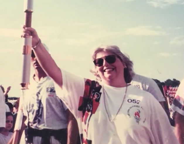Swann running with Olympic torch through Savannah.